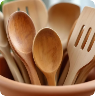 Wooden spoons and utensils as eco-friendly alternatives to single-use plastic kitchen tools.