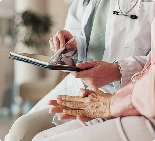 Doctor using a tablet with a patient, representing human health impacts of plastic exposure.